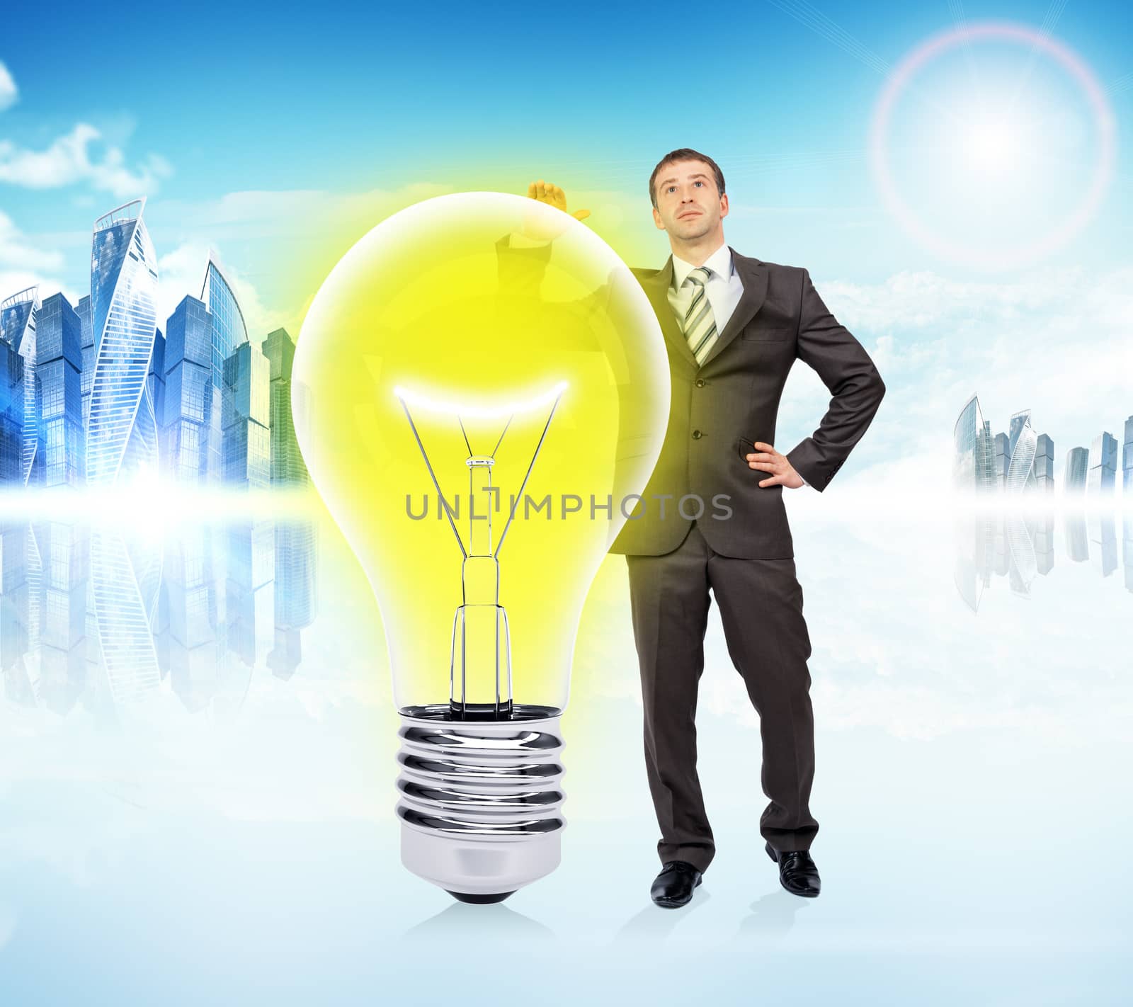 Idea concept with businessman and big light bulb by cherezoff