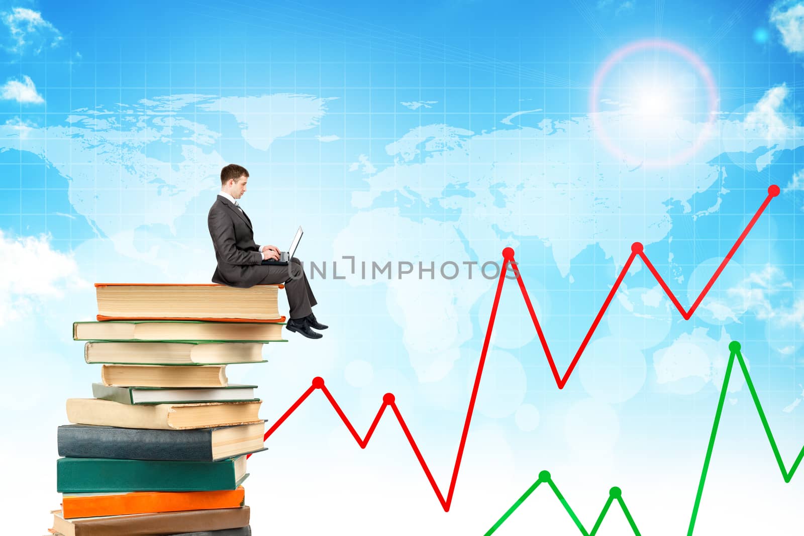 Businessman with laptop sitting on stack of books on blue sky background with chart