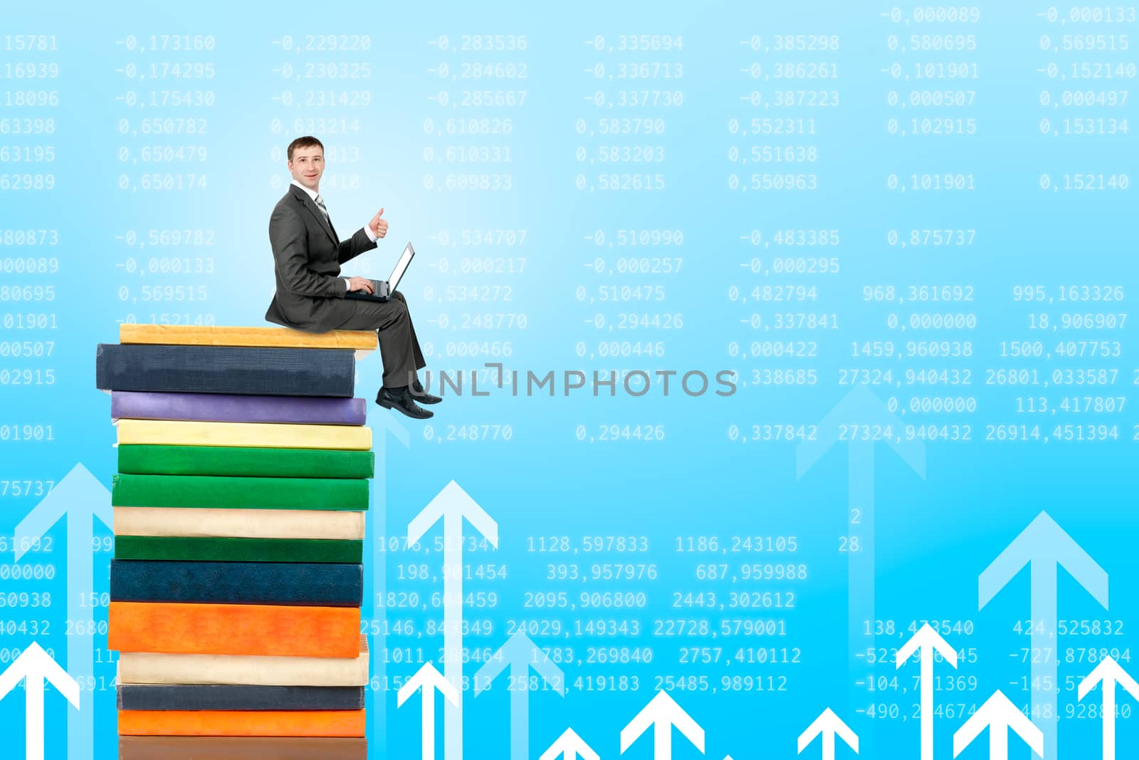 Businessman with laptop sitting on pile of books on graphical chart background