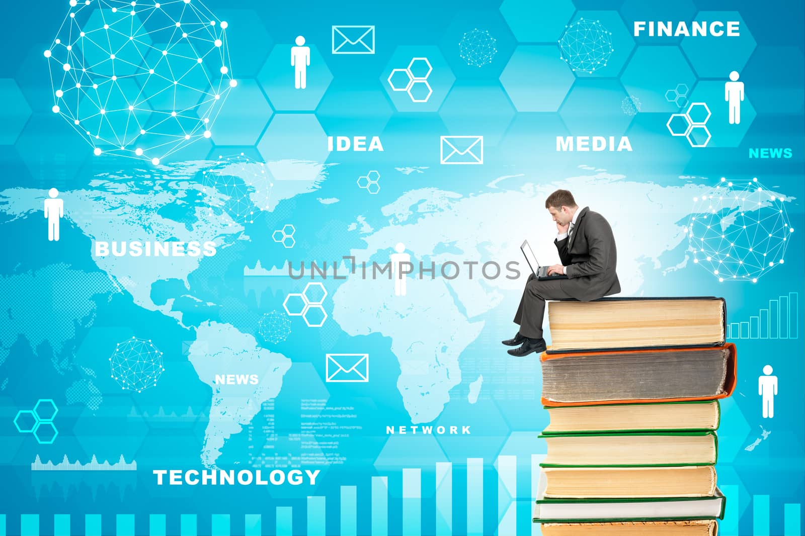 Businessman with laptop sitting on stack of books on blue background with world map