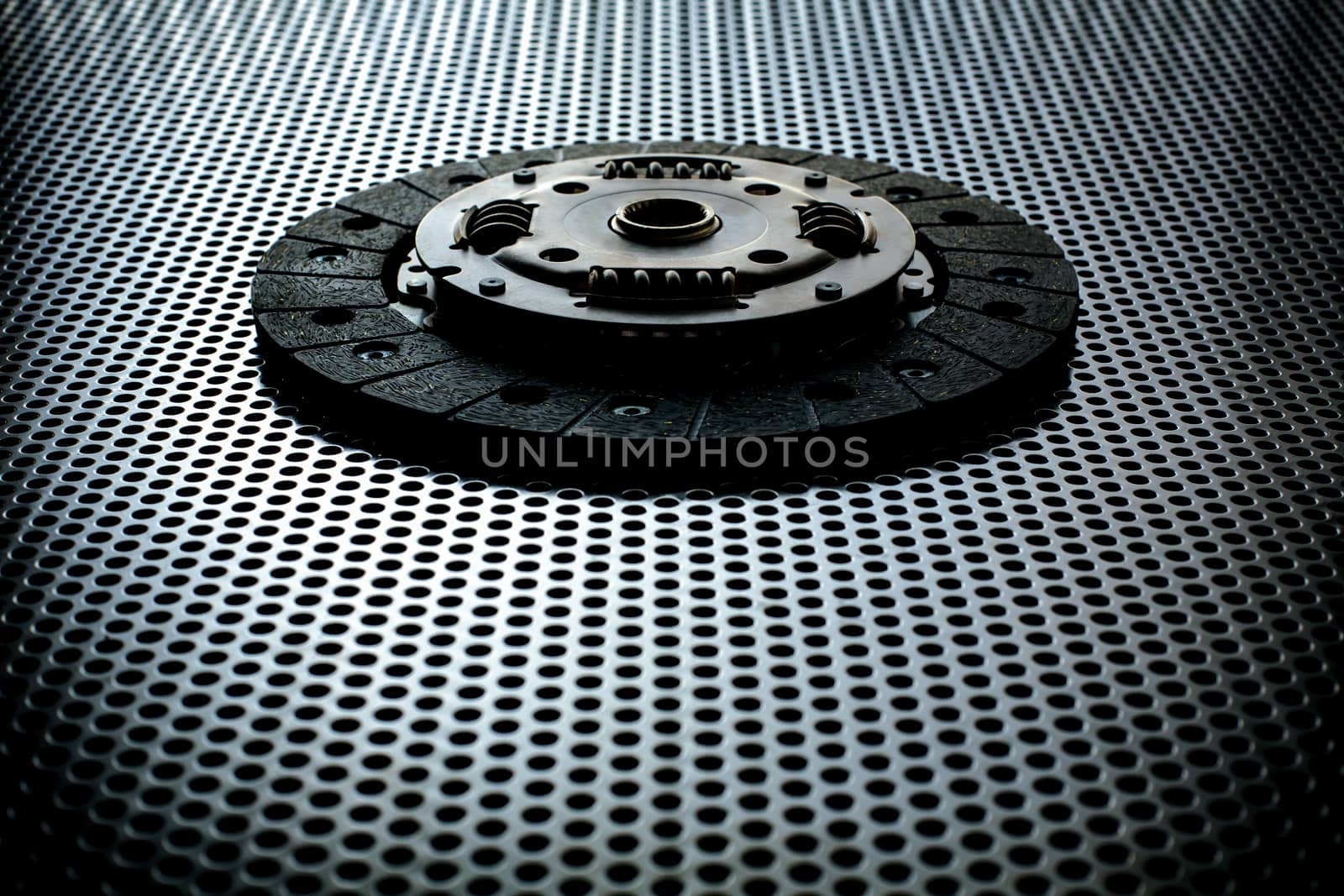 Car clutch on a metal surface by DmitrySteshenko