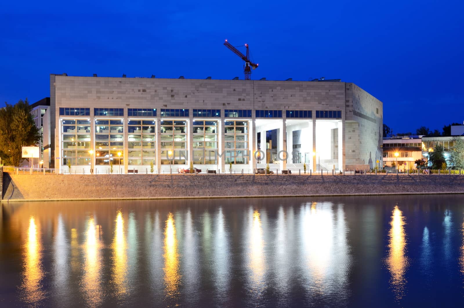 WROCLAW, POLAND - MAY 30: Wroclaw's University Library at Odra river bank by night. In 2016 Wroclaw is European Capitol of Culture. 