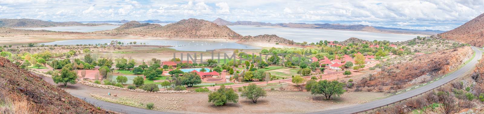 Stitched panorama of the holiday resort, harbor and yachts in the Gariep Dam. It is the largest dam in South Africa. The dam is half full