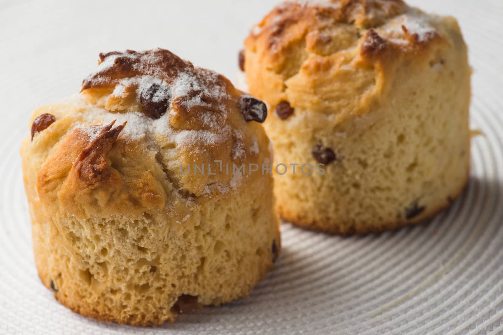 pair of homemade carrot muffins on white fabric background. top view by skrotov