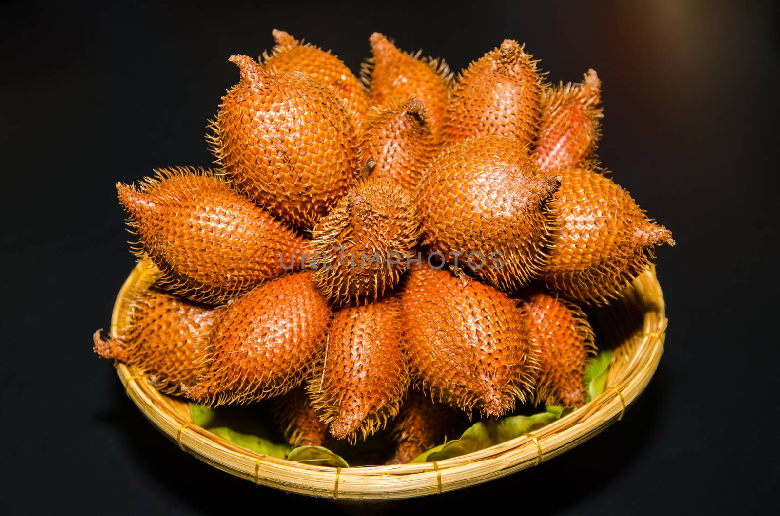 Wintergreen (Salacca wallichiana) on a basket. Wintergreen flesh is fruit seasonal of Thailand.