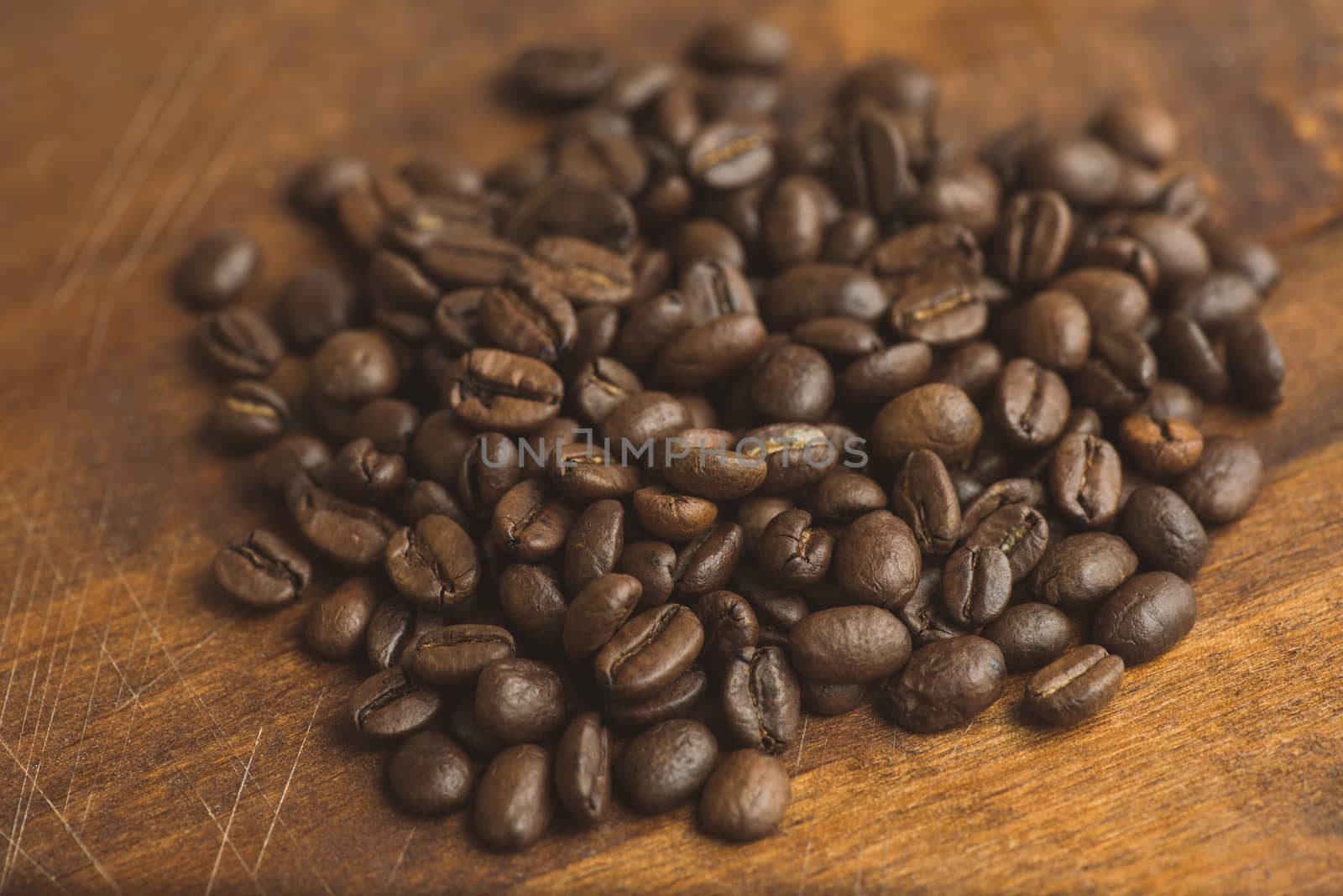 Brown coffee beans, closeup of macro coffee beans for background and texture by skrotov