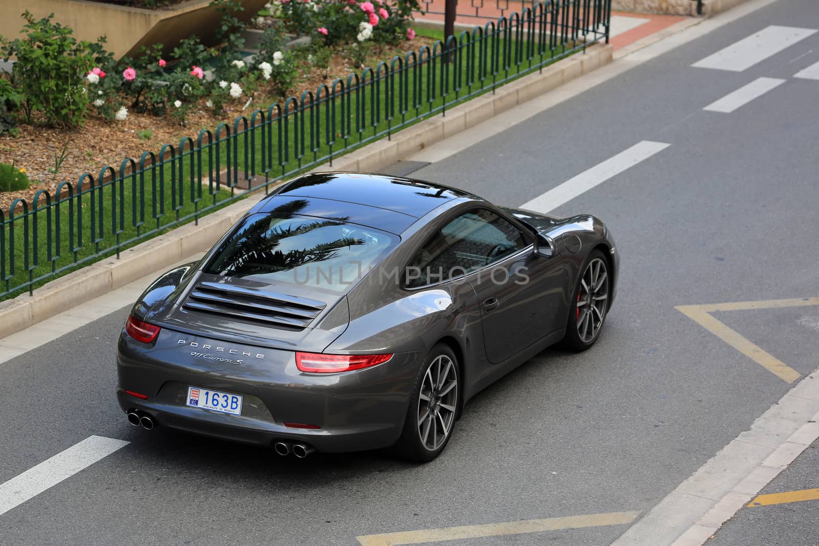 Monte-Carlo, Monaco - May 18, 2016: Luxury Black Porsche 911 Carrera S on Avenue Princesse Grace in Monte-Carlo, Monaco in the south of France