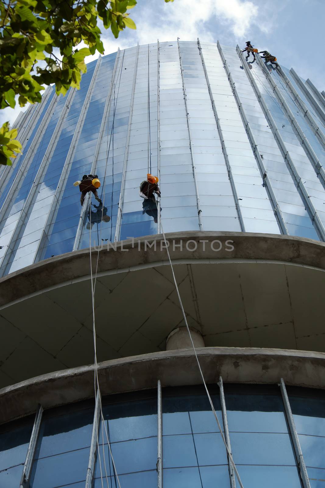 Asian worker climb on building, dangerous job by xuanhuongho