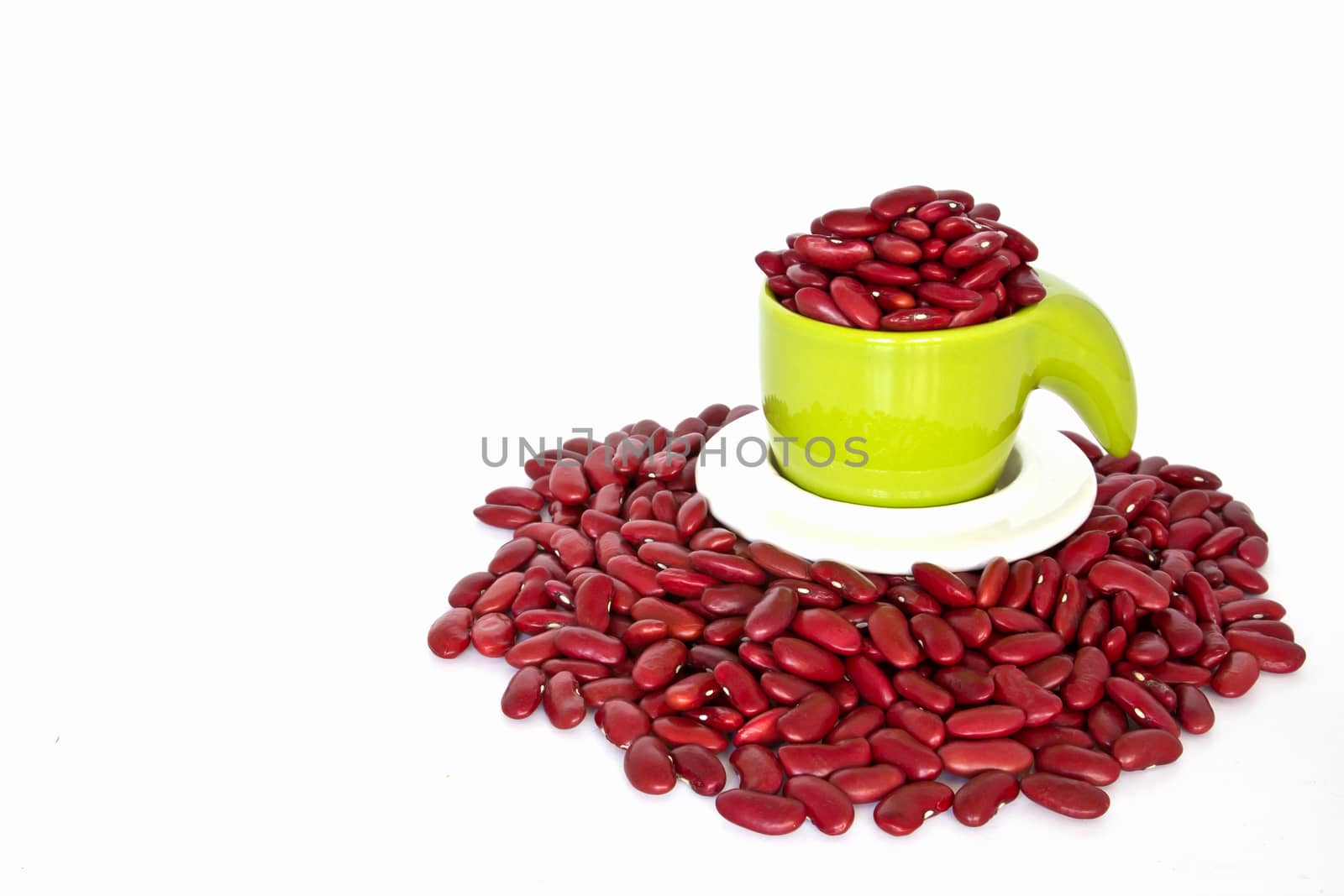 Red beans in green cup on white background