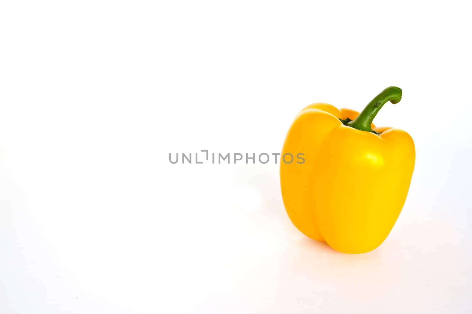 Yellow sweet peppers isolated on a white background  by ekachailo