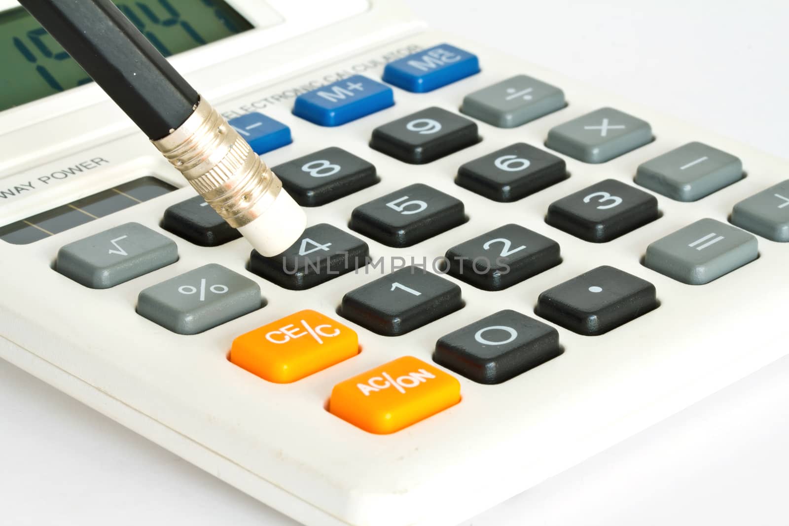 calculator and pencil on white  background