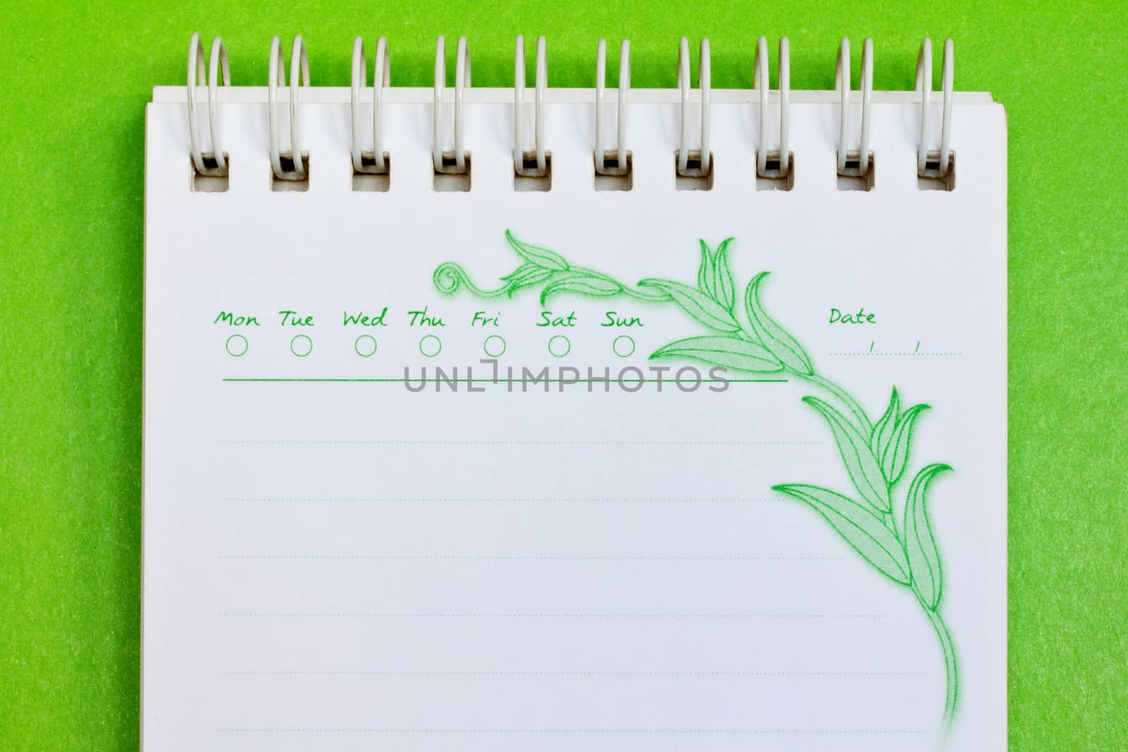 close up of a note paper on green background with clipping path 
