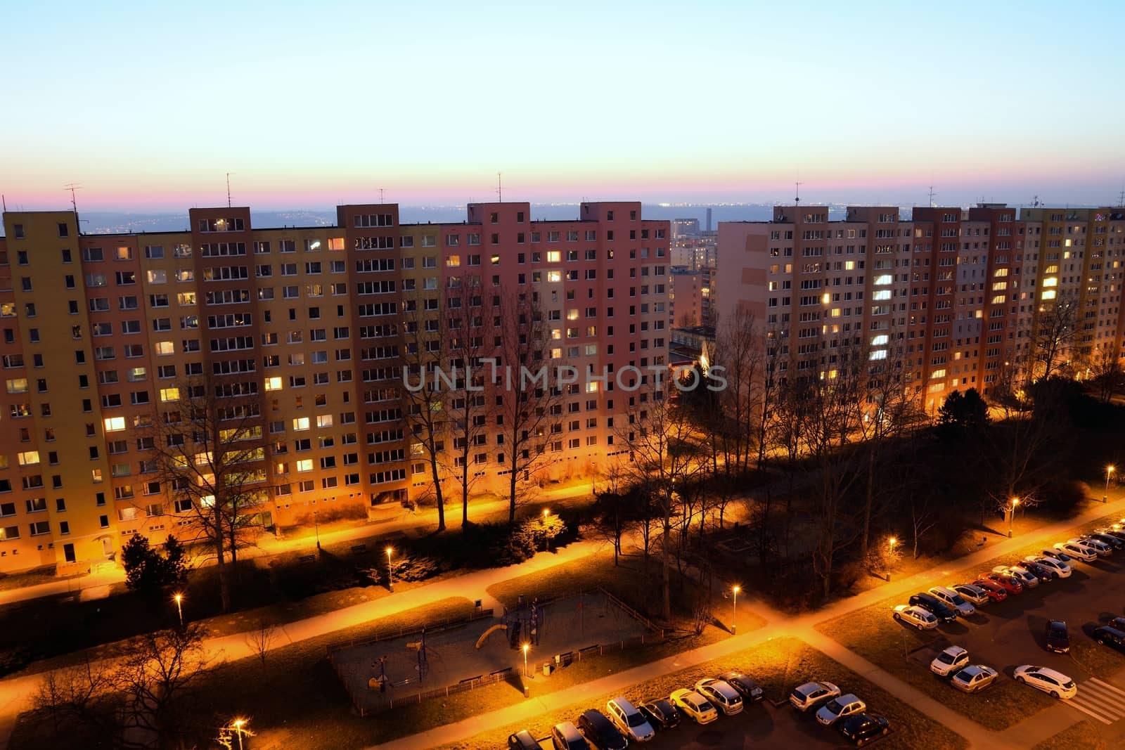 Housing development at sunset. Block of flats at night.