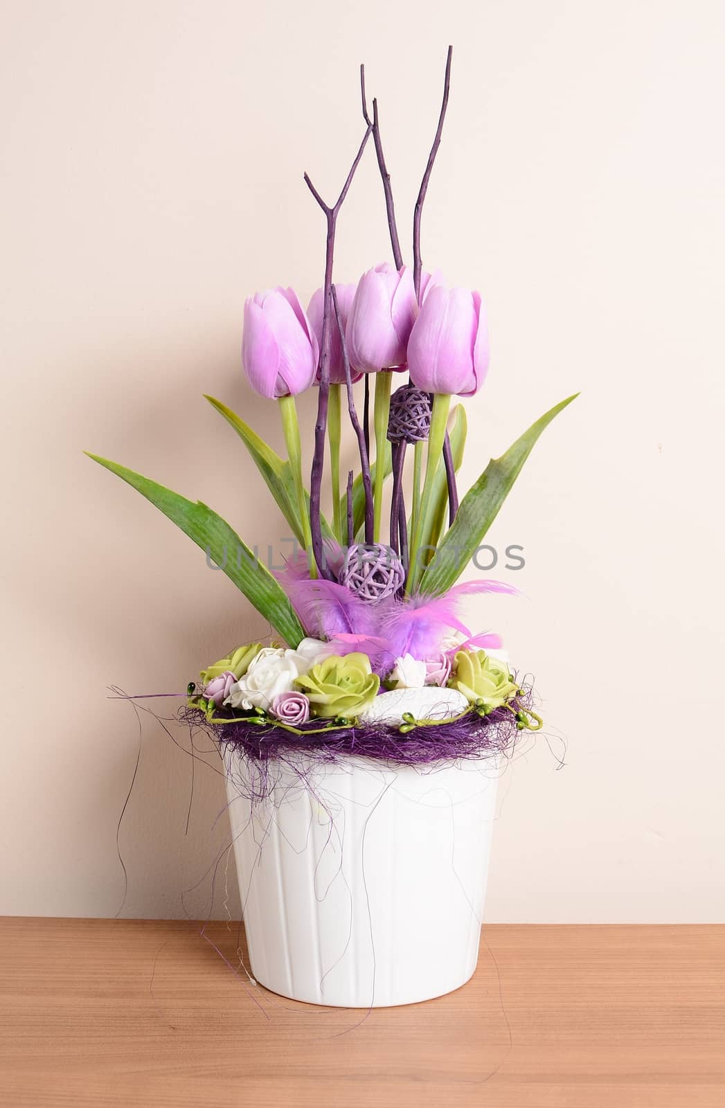 Interior decoration, decorative purple tulips in the white flowerpot.