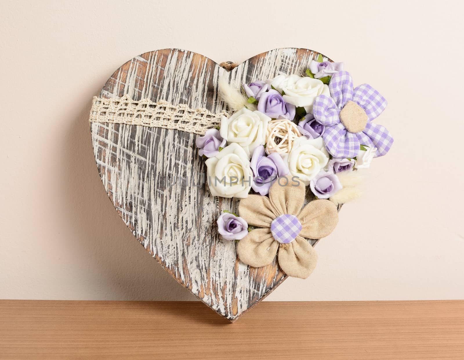 Interior decoration, decorative wooden heart with purple rose.