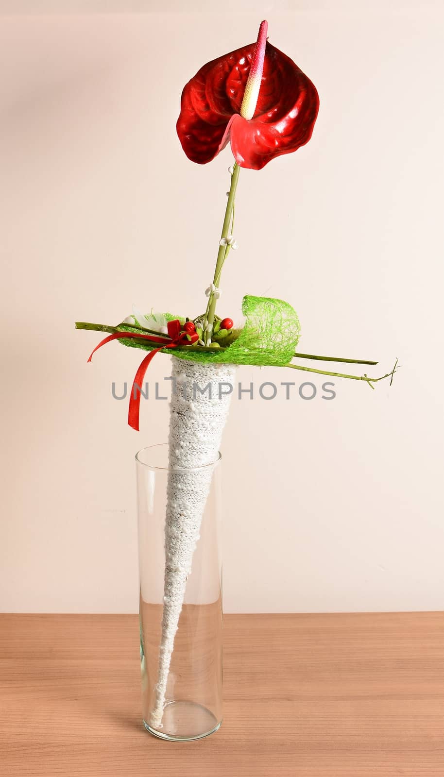 Interior decoration, decorative red flower in the glass.