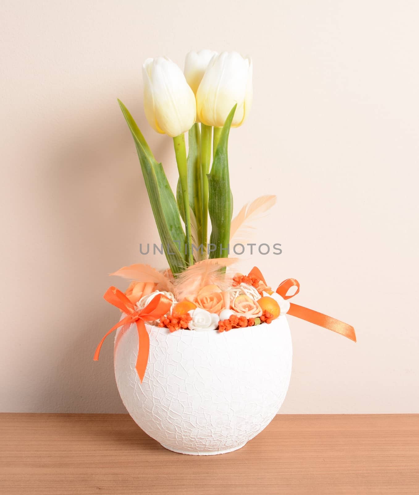 Interior decoration, decorative white tulip in the white flowerpot.