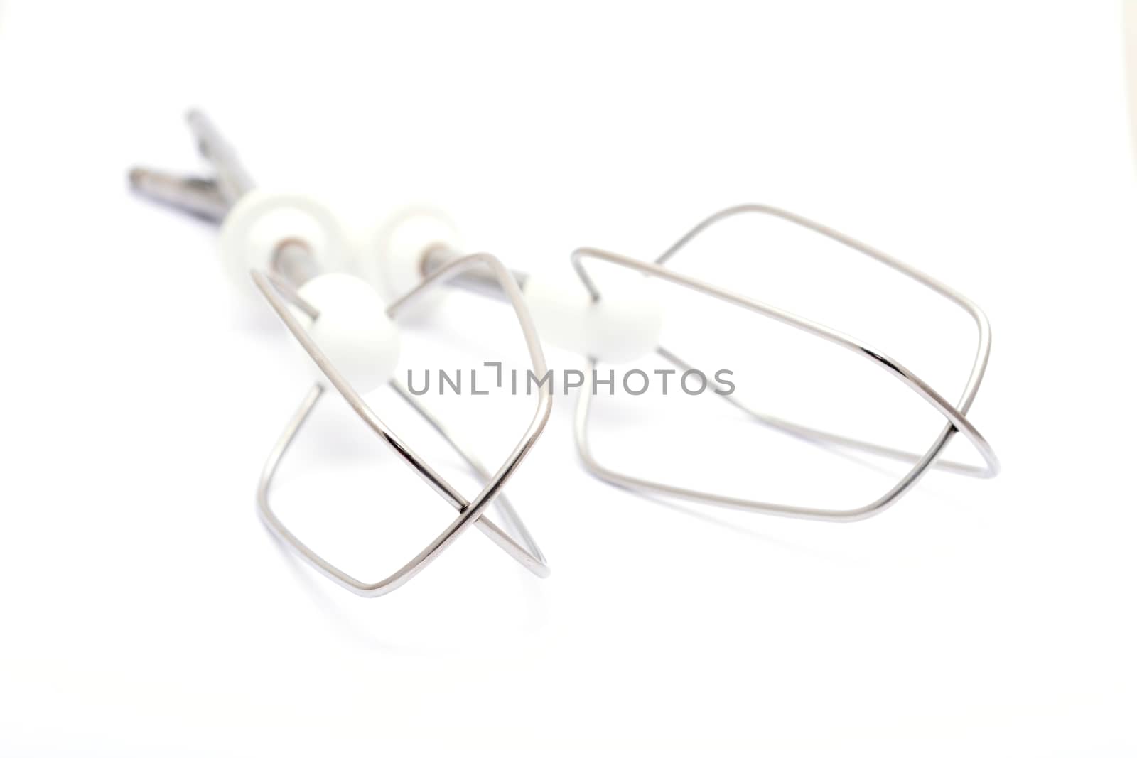 A set of two kitchen whisks placed on a white background.