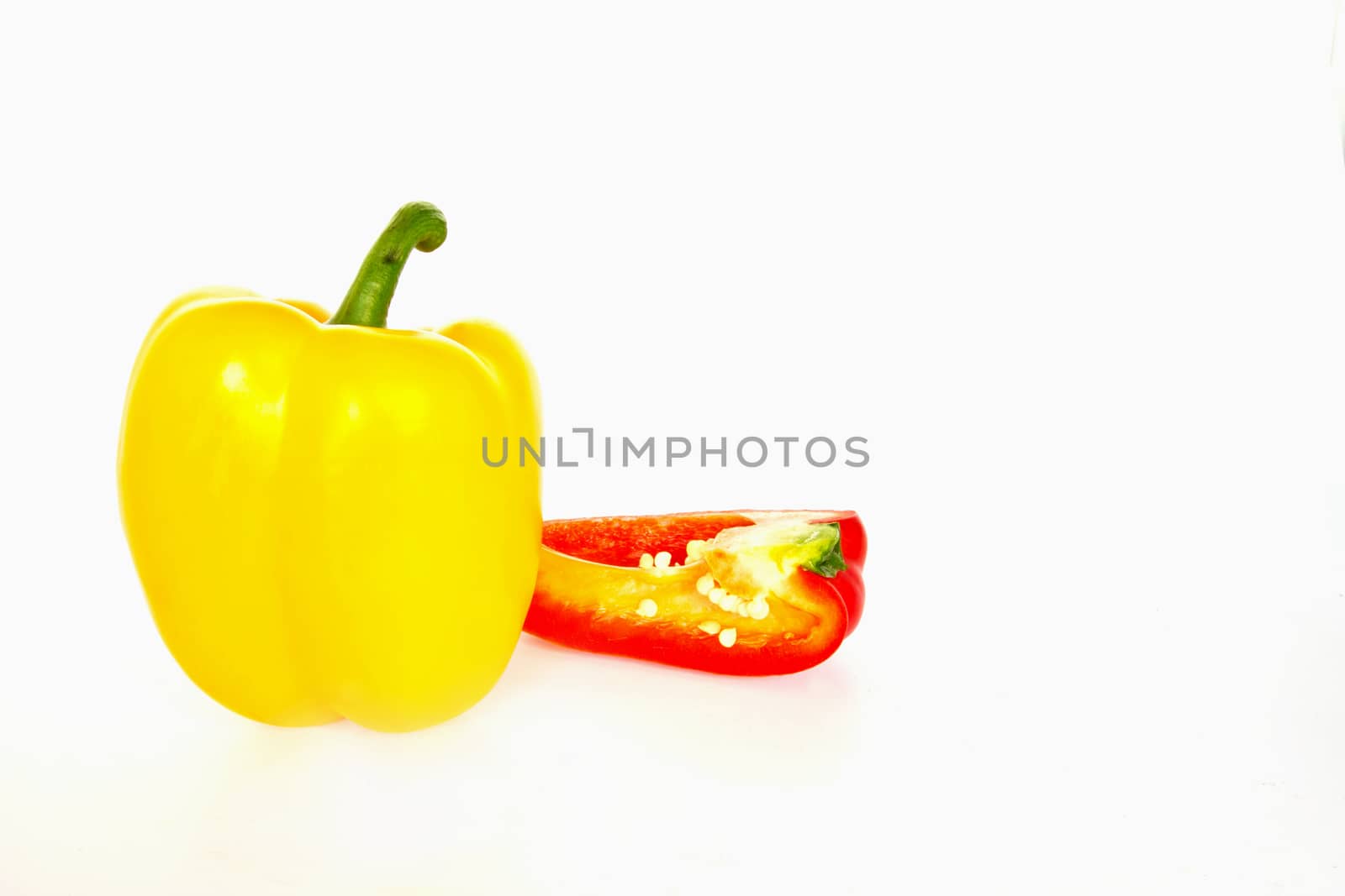 Yellow and Red sweet peppers isolated on a white background  by ekachailo
