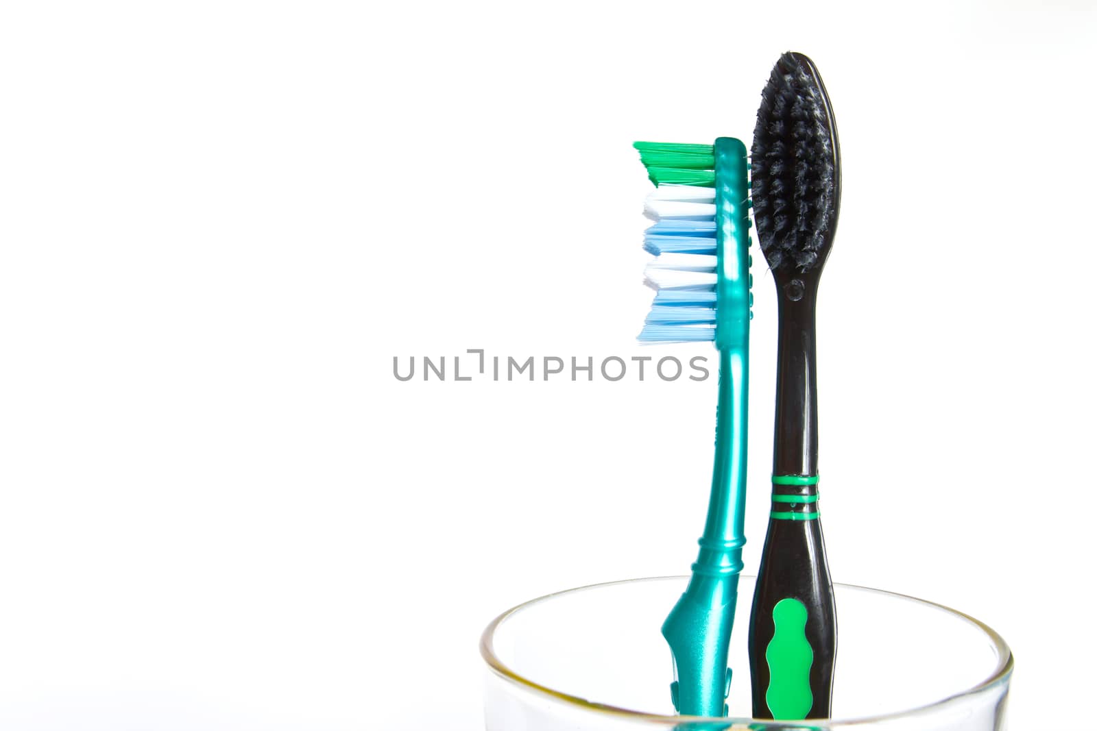 Two tooth brushes, closeup isolated on white  by ekachailo