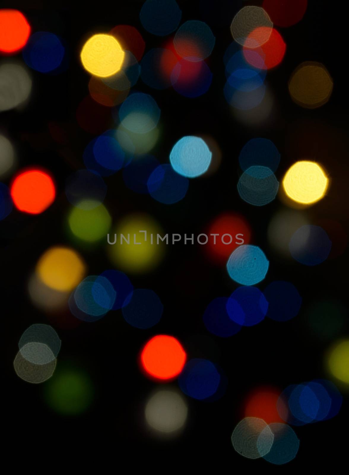 Color blurred bokeh lights. Useful for Christmas background or greeting cards.