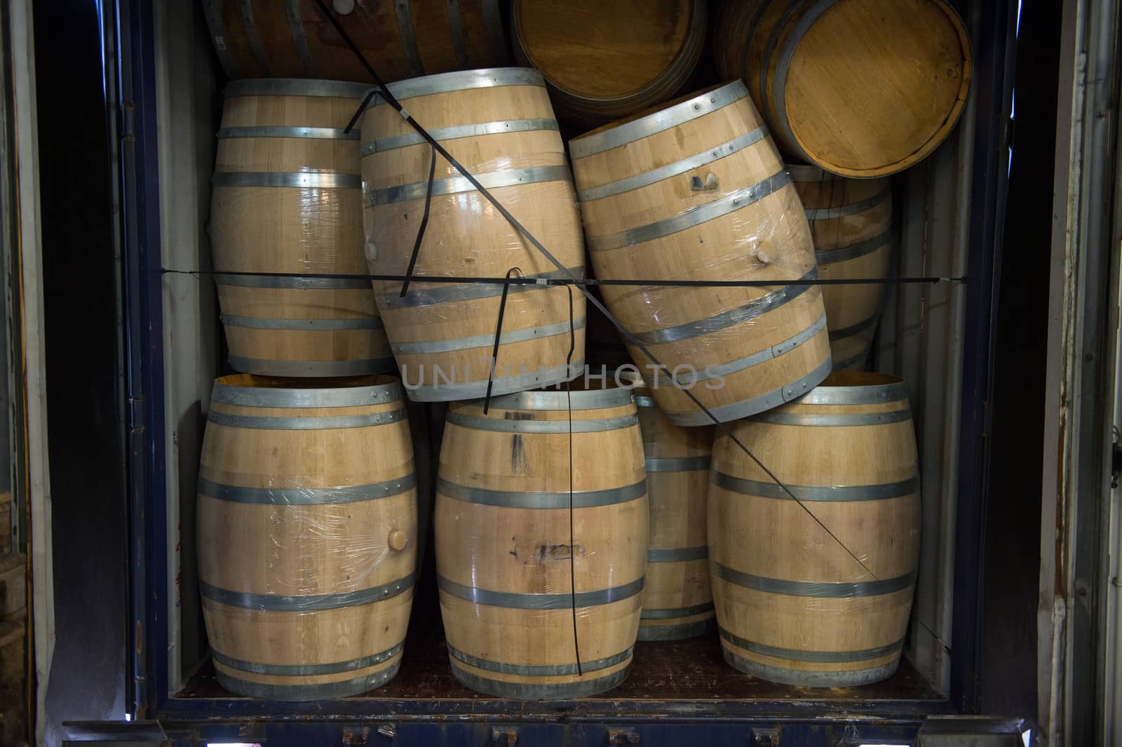 Wine barrels stacked in Truck ,Loading dock, Bordeaux Vineyard, France