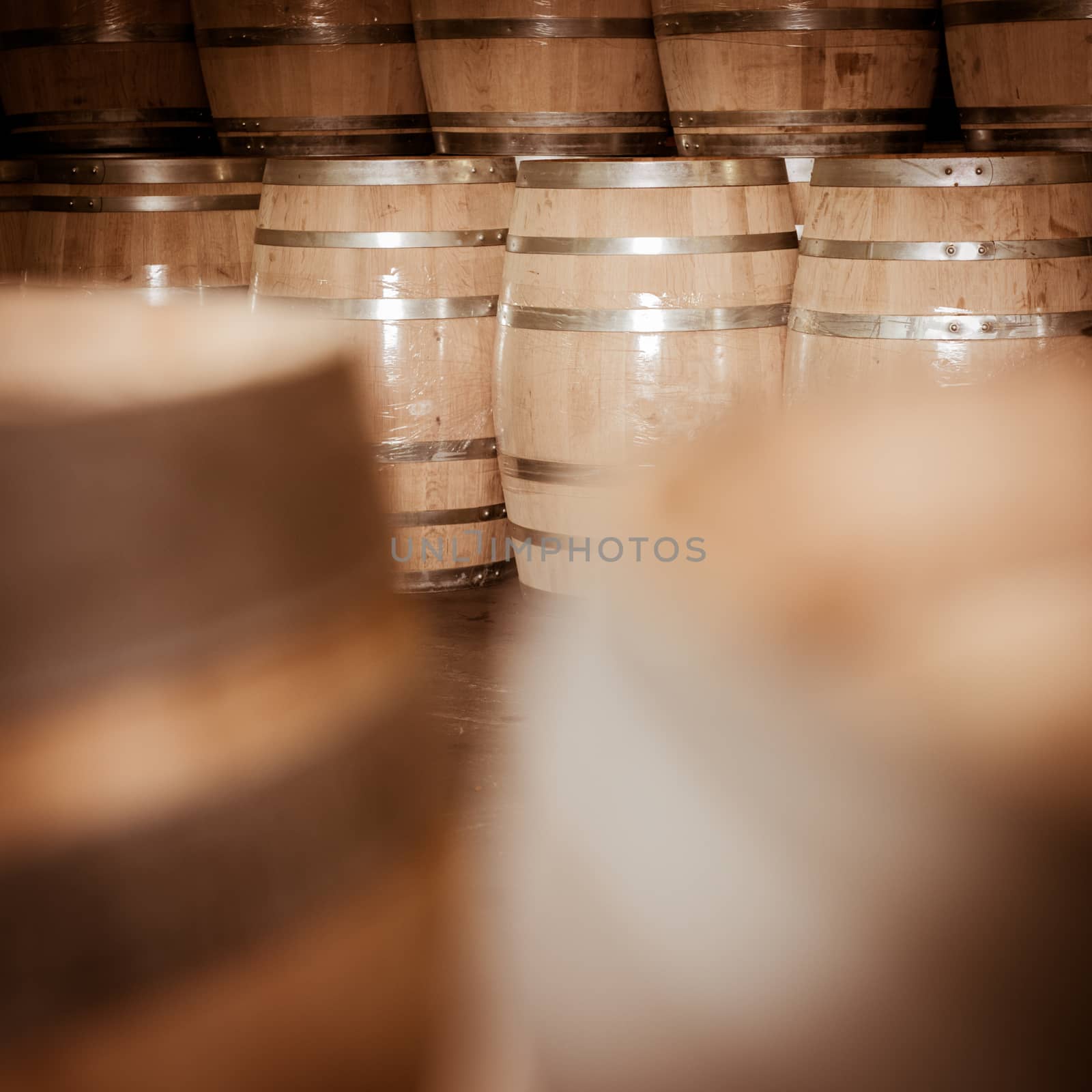 Wine barrels stacked in cellar, Bordeaux Vineyard, France