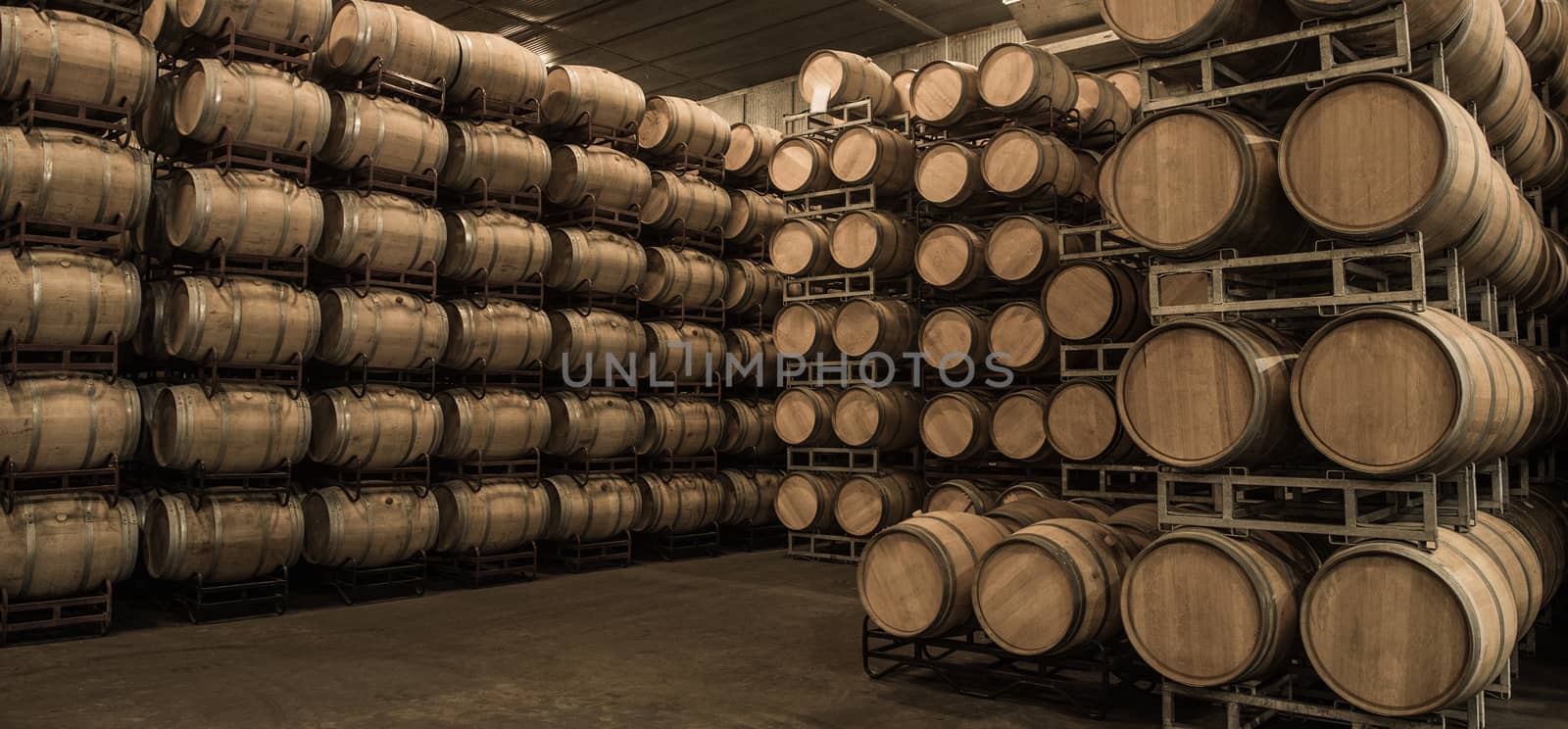 Wine barrels stacked in cellar, Bordeaux Vineyard, France