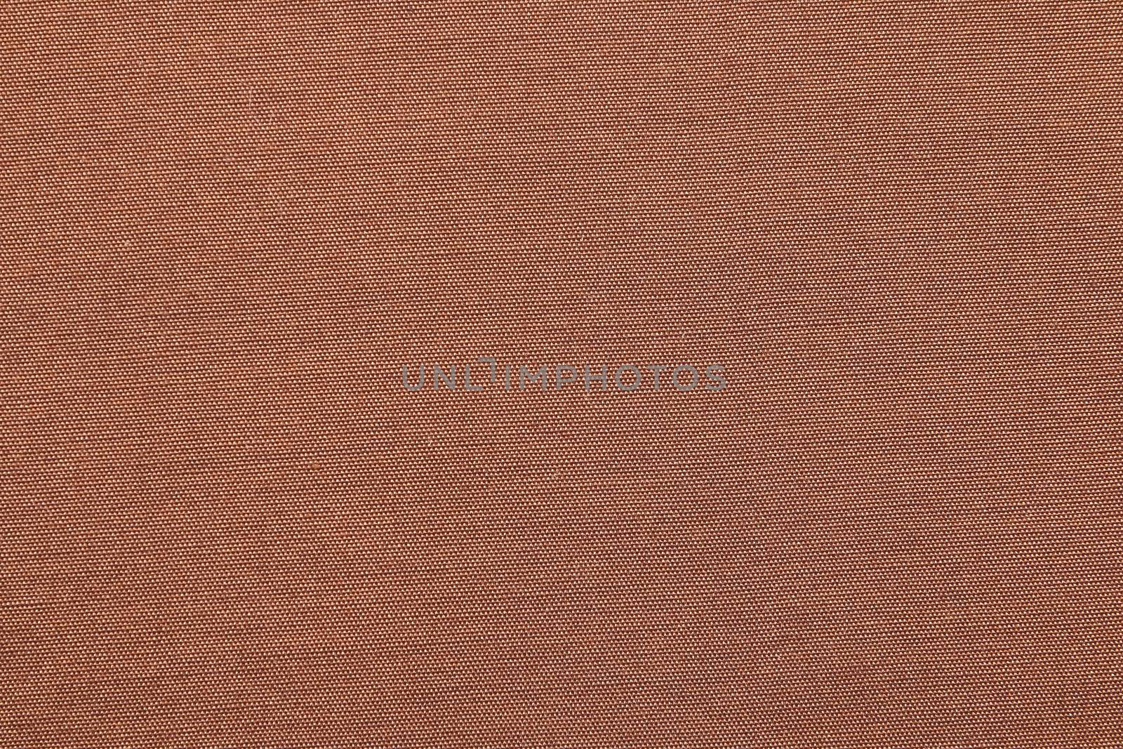 The closeup brown cotton background with textile texture