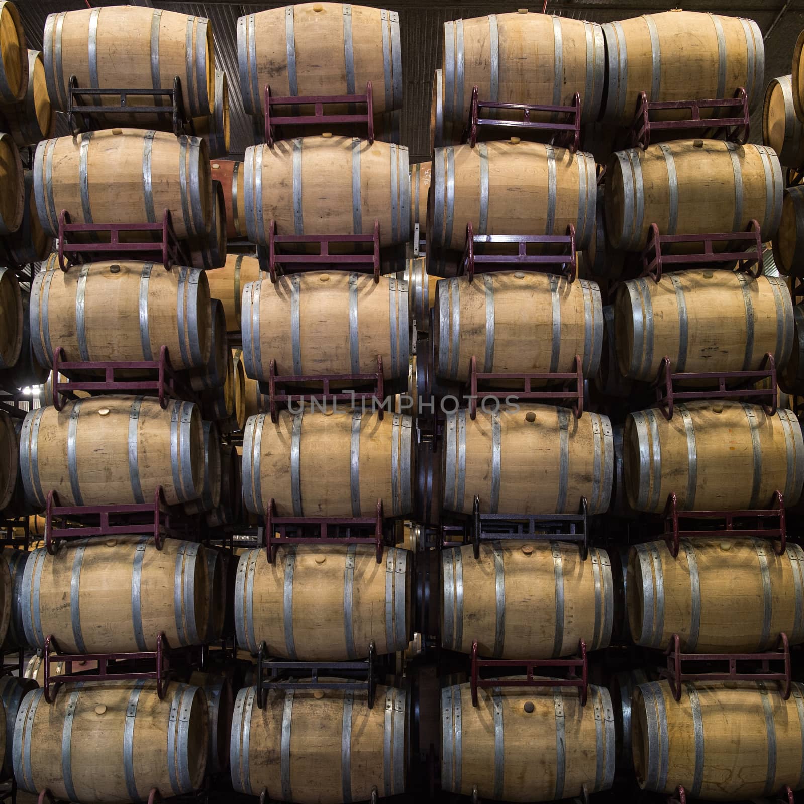 Wine barrels stacked in cellar, Bordeaux Vineyard, France