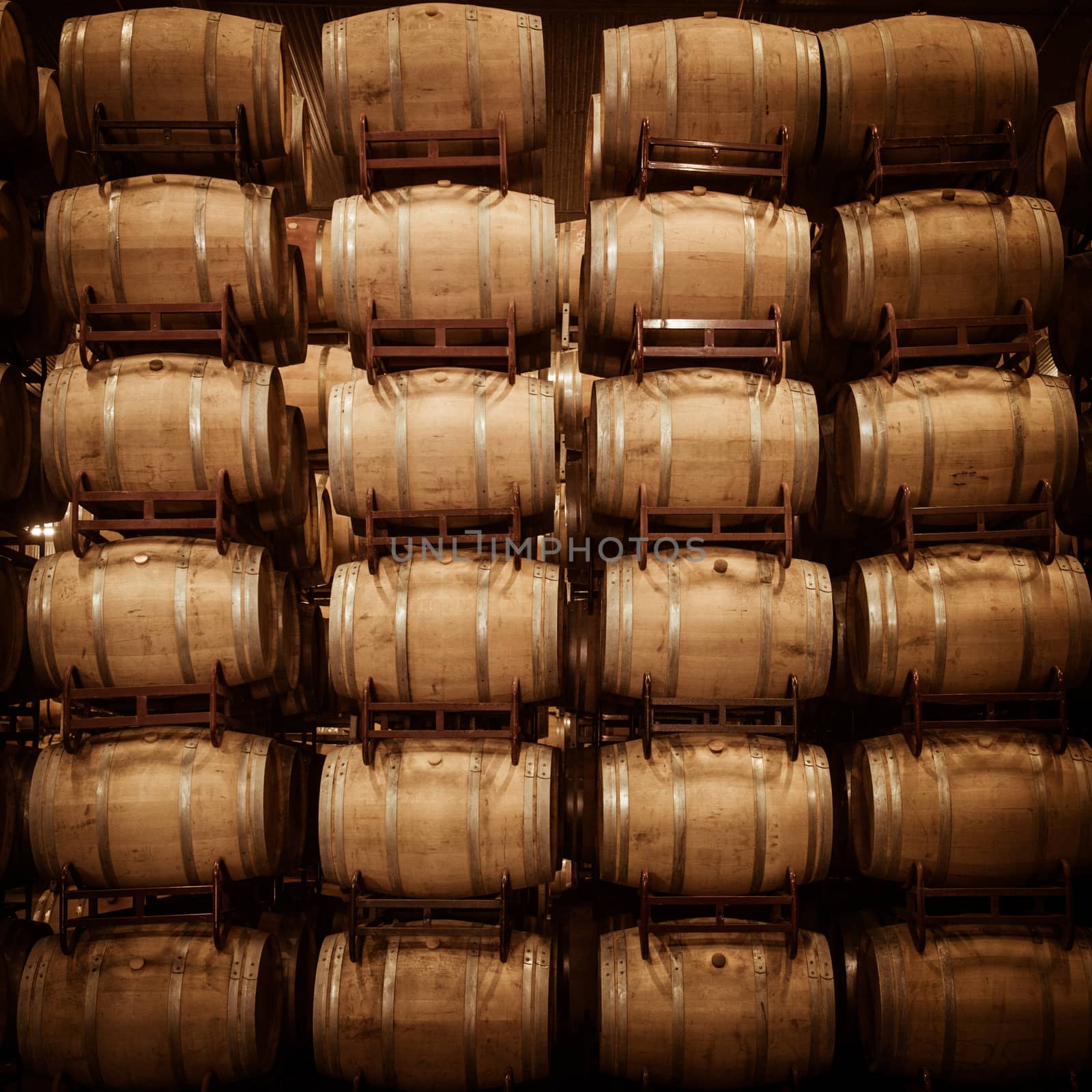 Wine barrels stacked in cellar, Bordeaux Vineyard, France