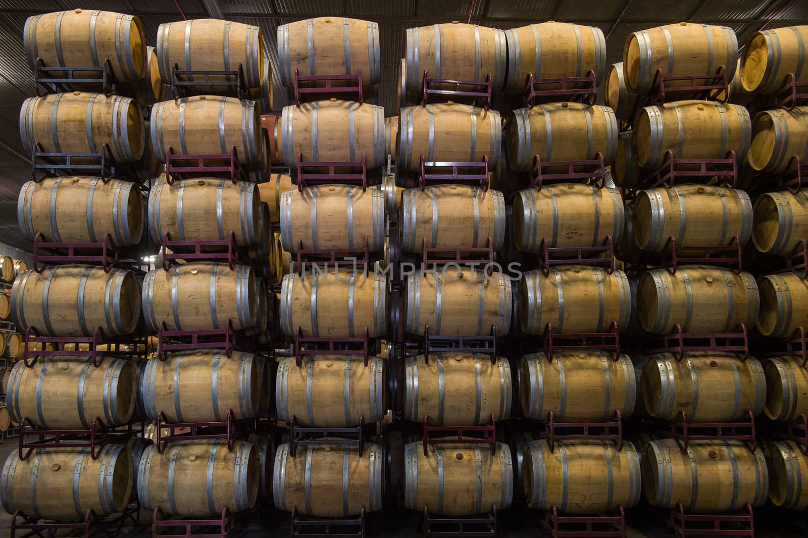 Wine barrels stacked in cellar, Bordeaux Vineyard, France