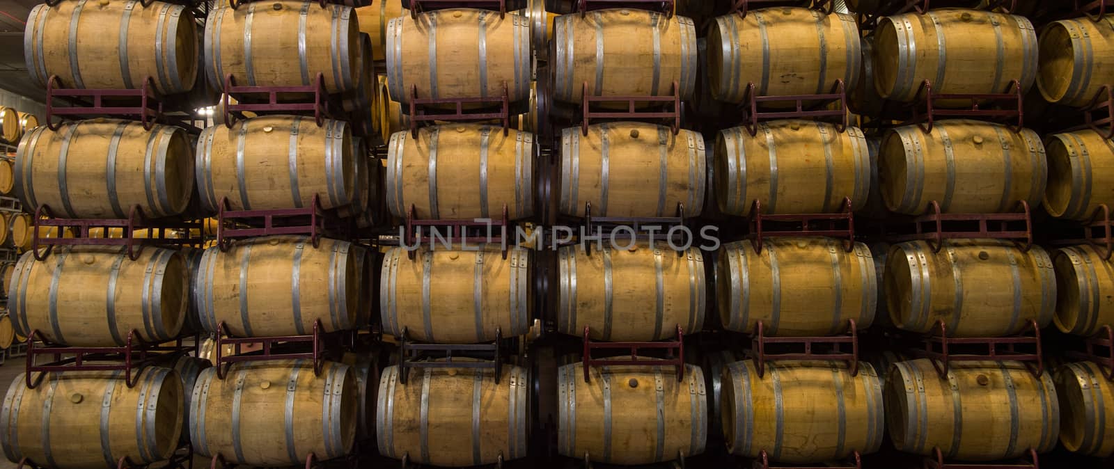 Wine barrels stacked in cellar, Bordeaux Vineyard, France