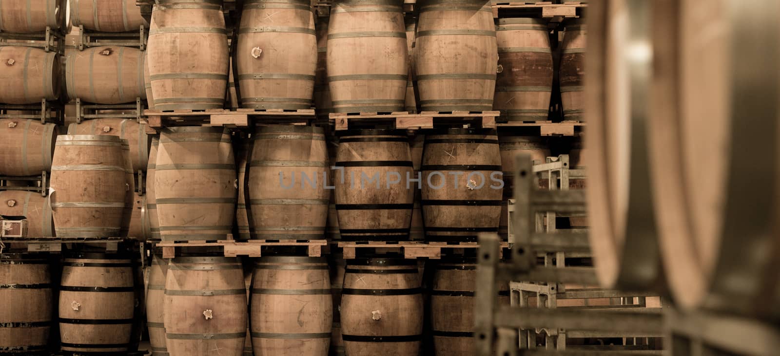 Wine barrels stacked in cellar, Bordeaux Vineyard, France