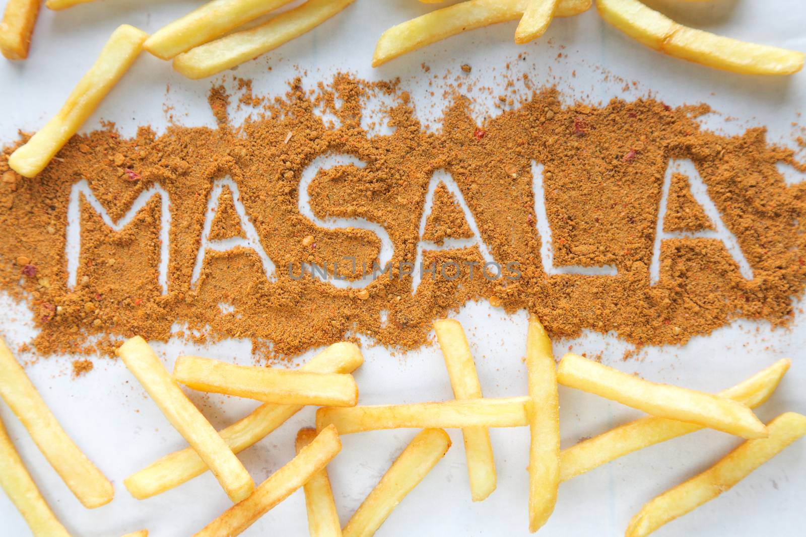 Masala written text with Potato chips french fries by haiderazim