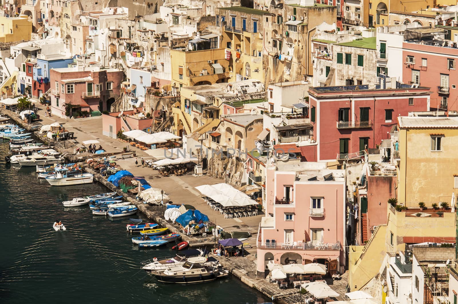 view of the harbour and the colored buildings in Procida, Naples