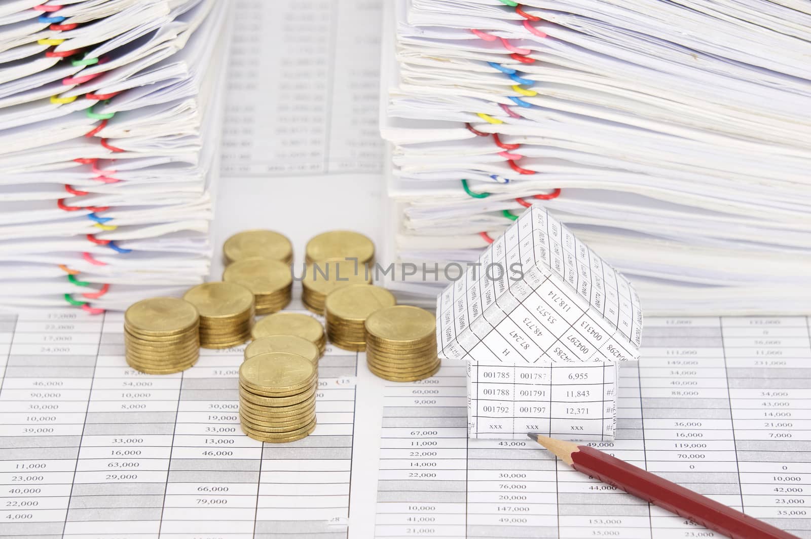 Close up house and pencil with coins have dual document by eaglesky