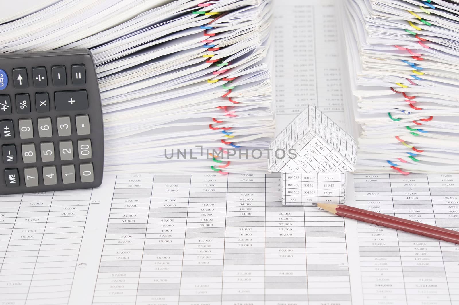 House and pencil have dual overload document as background by eaglesky