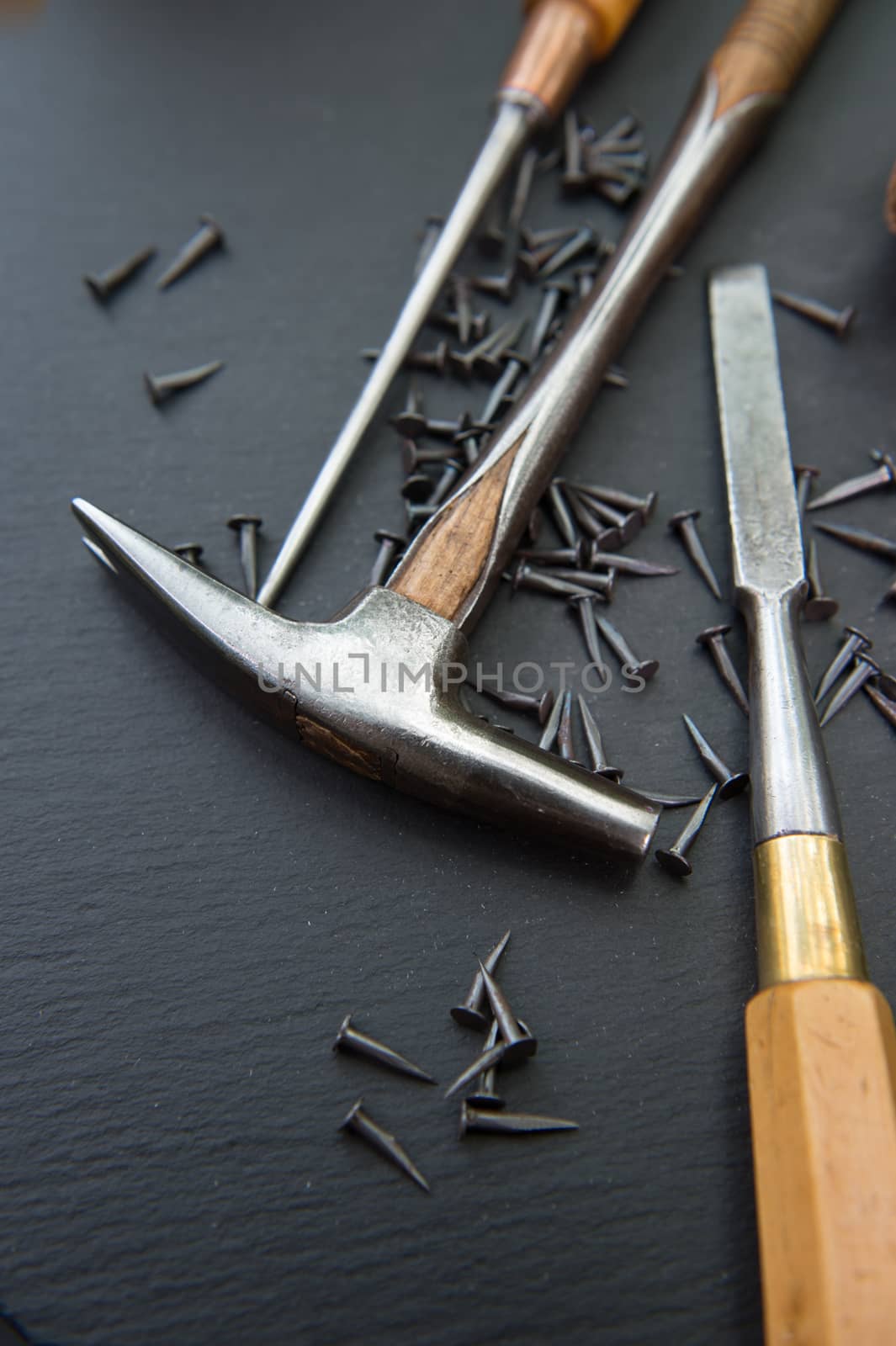 Traditional tools of upholsterer on a table closeup