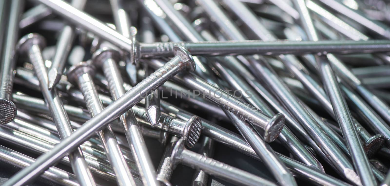 Carpenter long nails on a table closeup