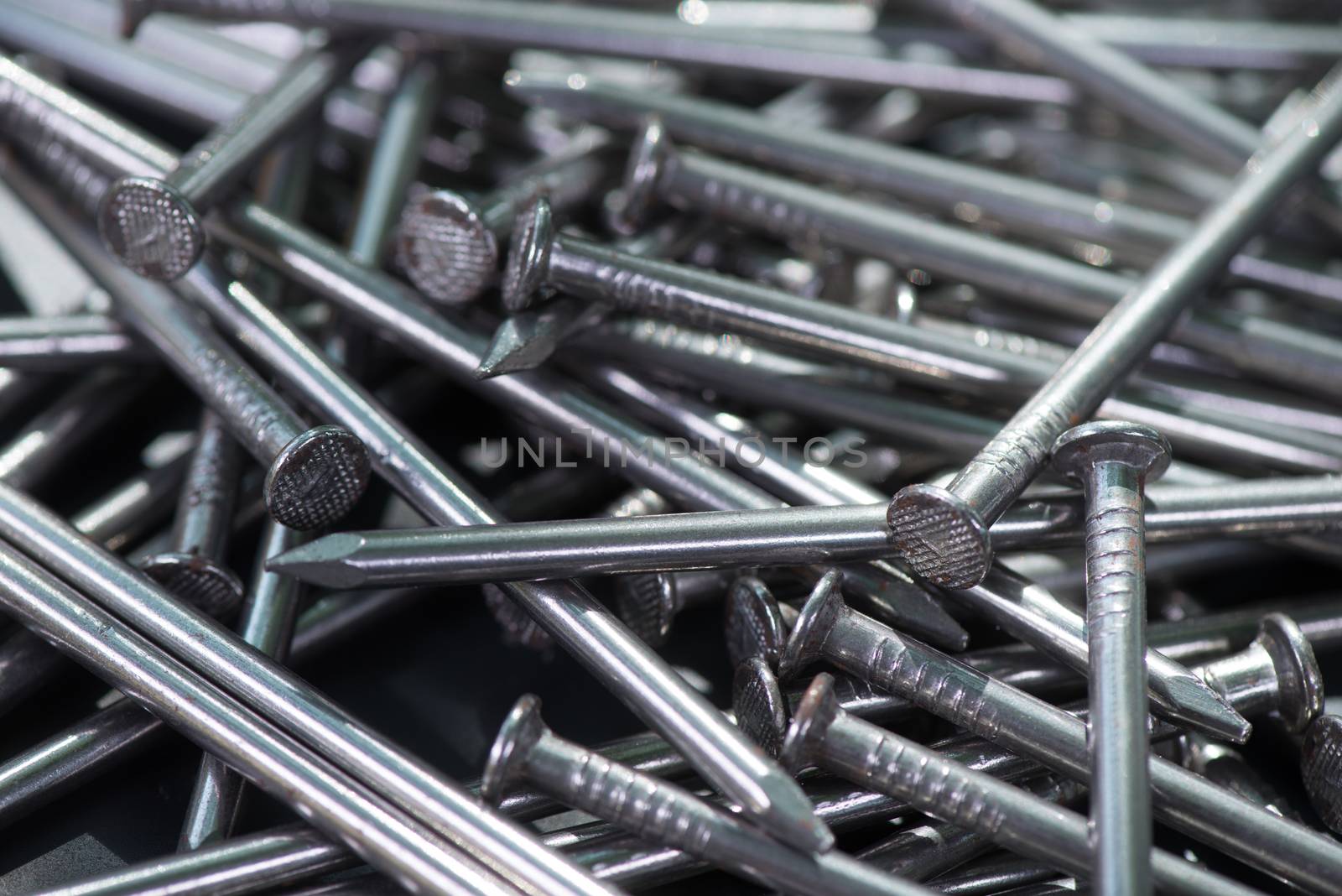 Carpenter long nails on a table closeup