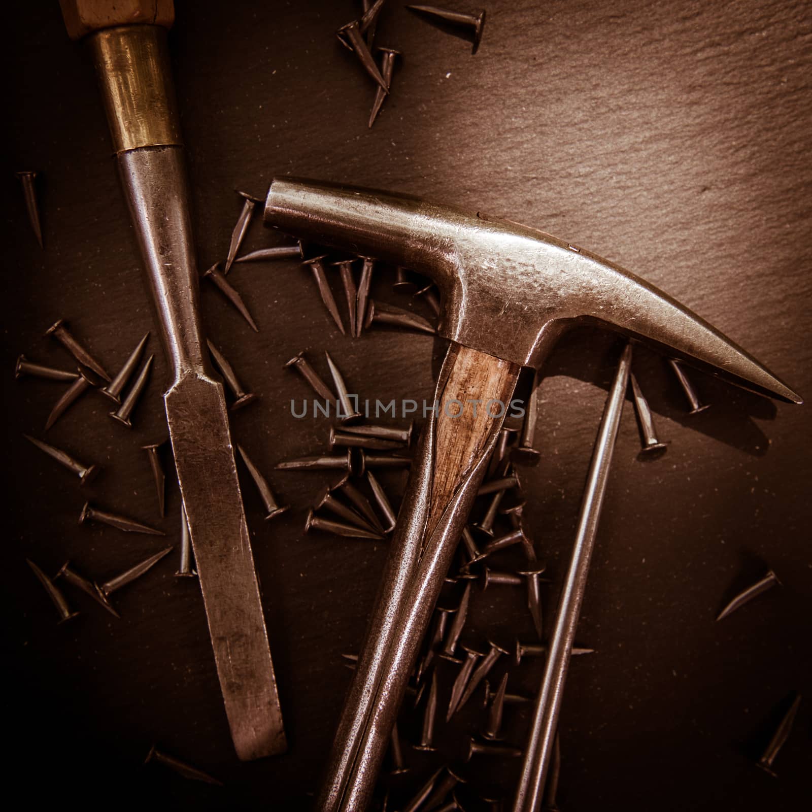 Traditional tools of upholsterer on a table closeup