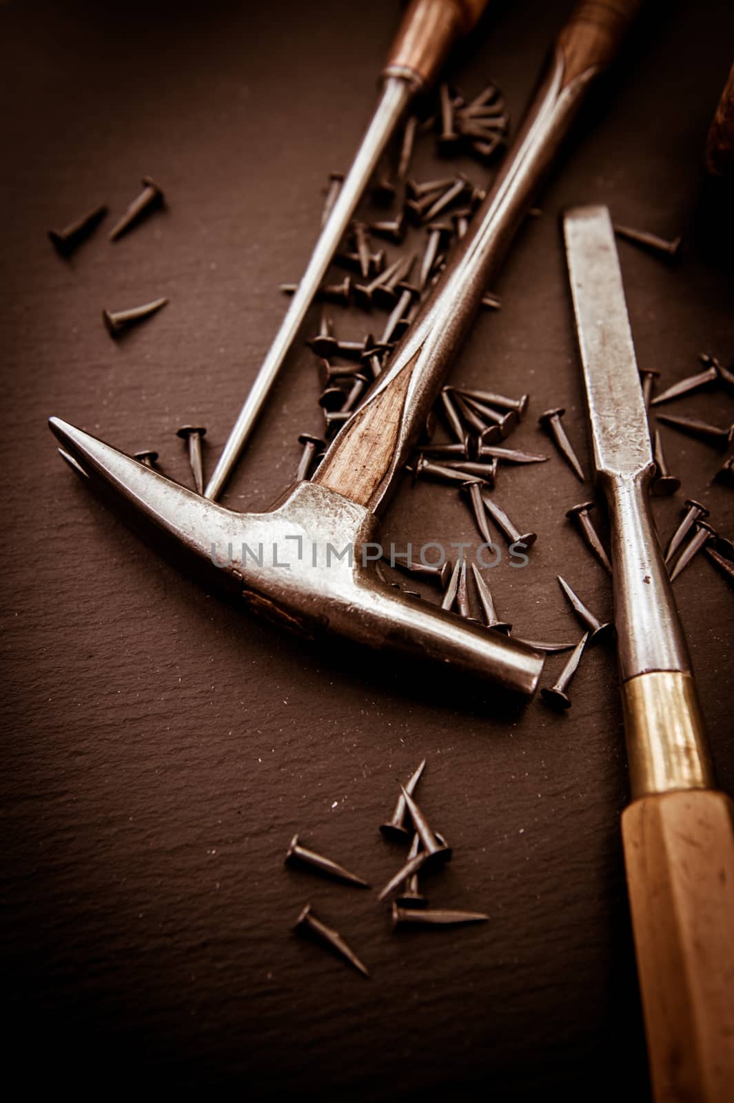 Traditional tools of upholsterer on a table closeup