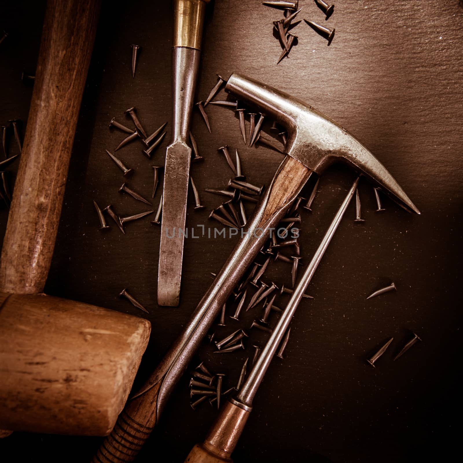 Traditional tools of upholsterer on a table closeup