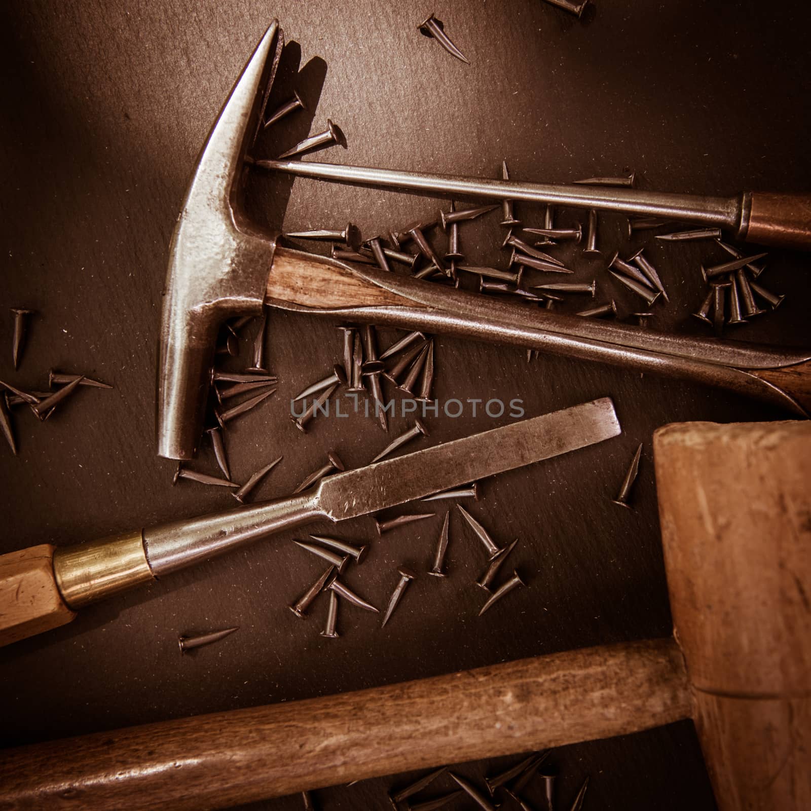 Traditional tools of upholsterer on a table closeup