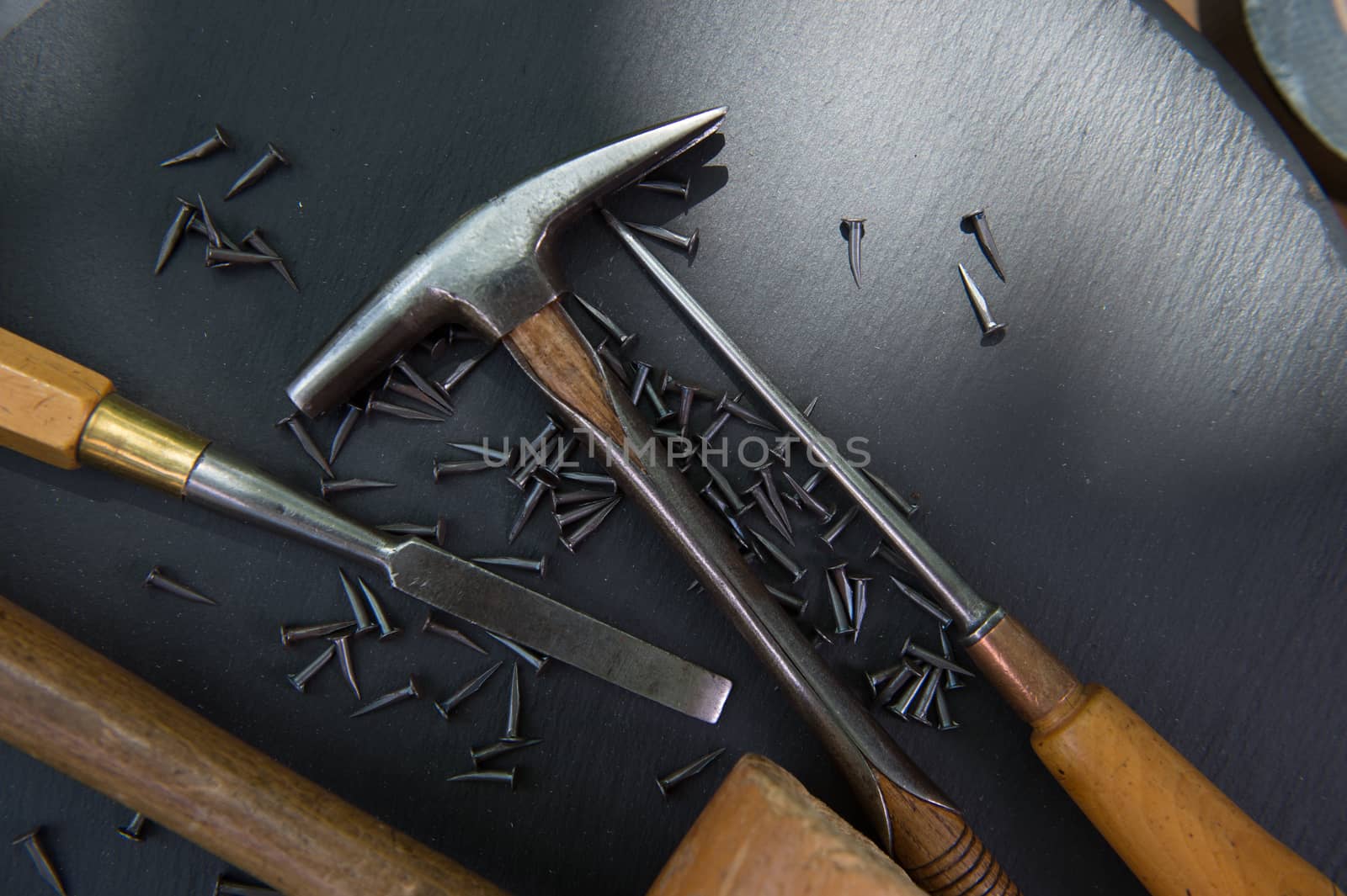 Traditional tools of upholsterer on a table closeup