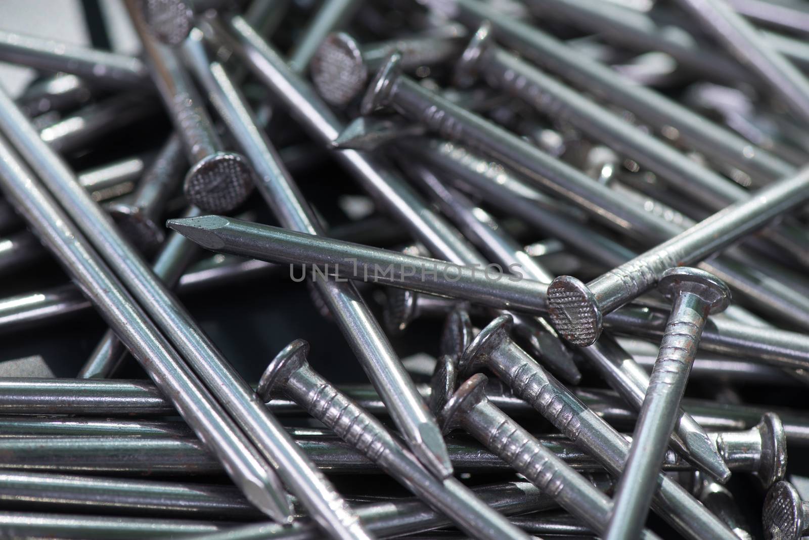 Carpenter long nails on a table closeup