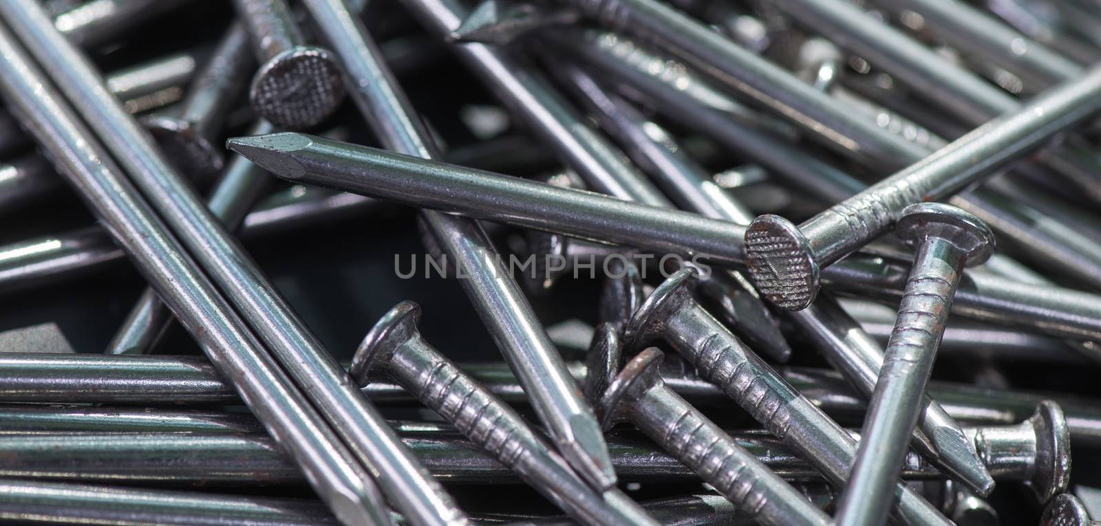 Carpenter long nails on a table closeup