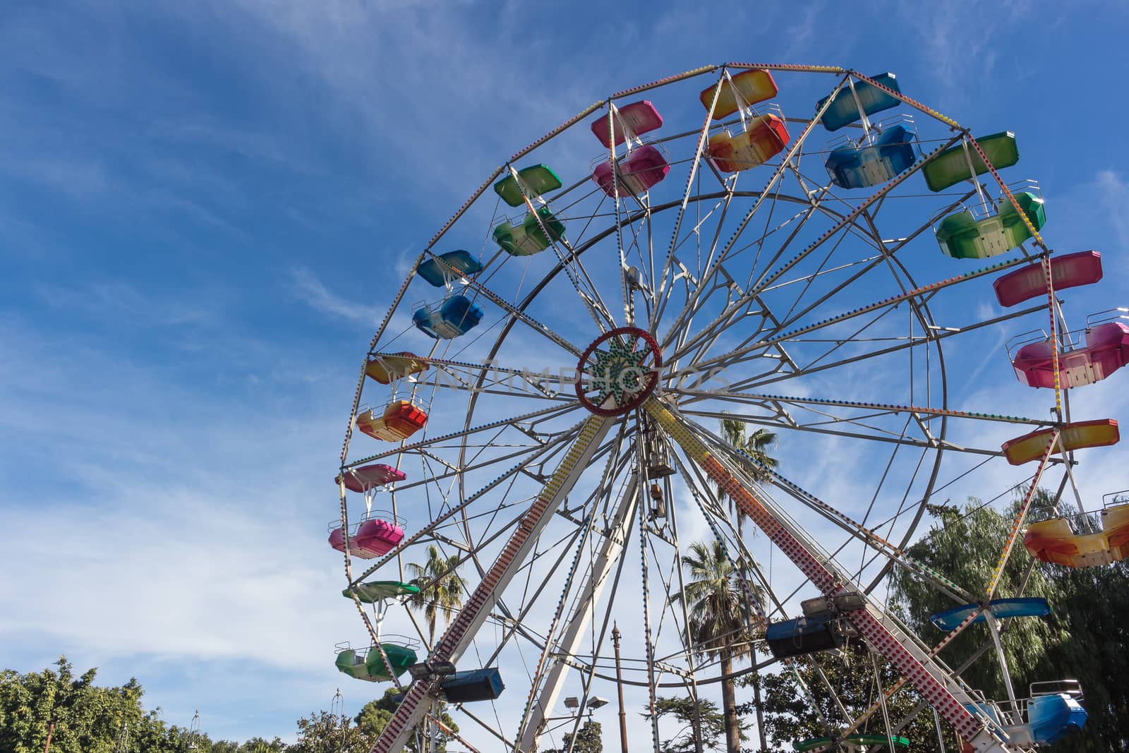 A colourful ferris wheel. Front view