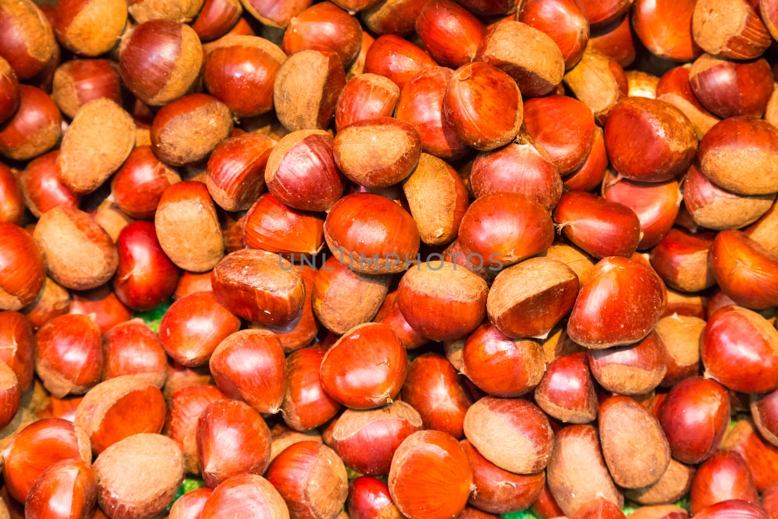 Pile of chestnuts. Autumn background.